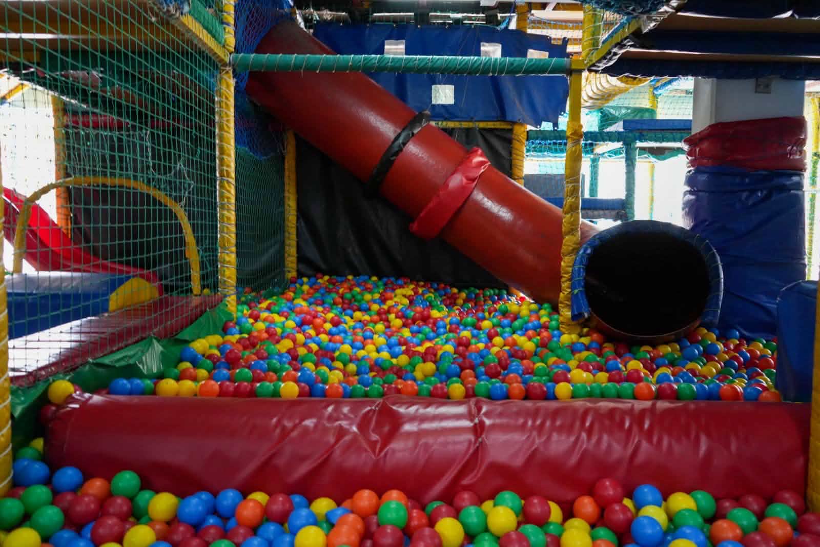 Ball pit with red tube slide